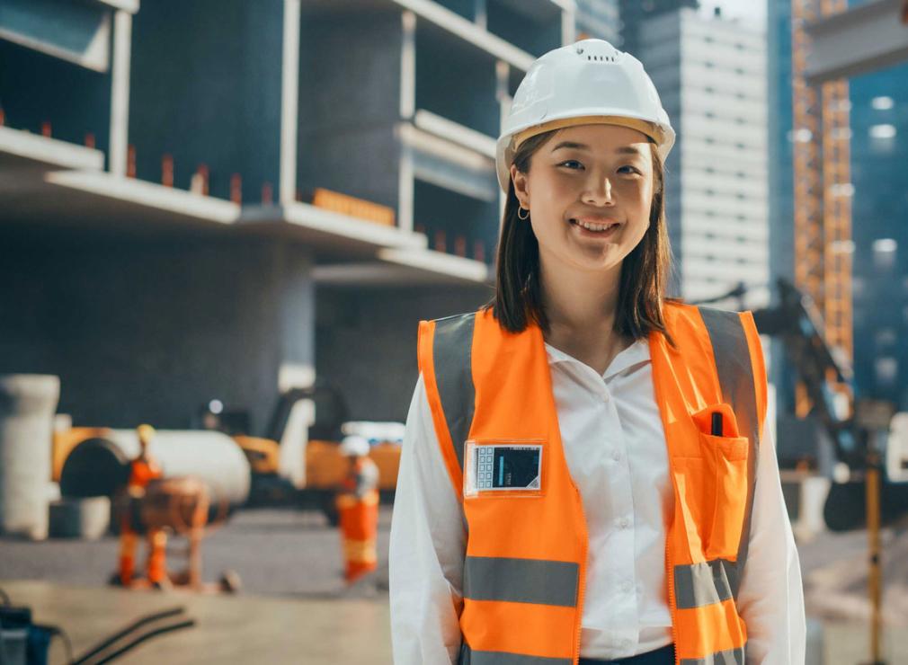 Woman in hardhat at a construction site